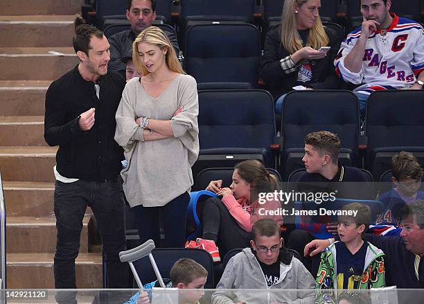 Jude Law, guest, Iris Law, Finlay Law and Rudy Law attend the Ottawa Senators vs New York Rangers game at Madison Square Garden on April 14, 2012 in...