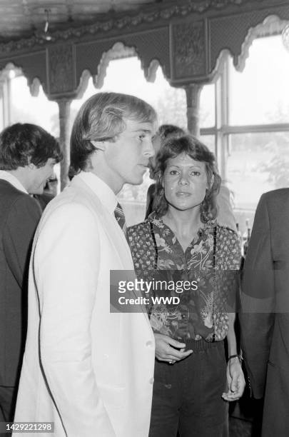 Tennis players John Lloyd and Evonne Googalong attend the Wimbledon luncheon in London, England, on June 22, 1982.