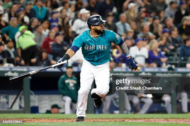 Carlos Santana of the Seattle Mariners hits a double during the fourth inning against the Oakland Athletics at T-Mobile Park on September 30, 2022 in...