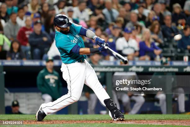 Carlos Santana of the Seattle Mariners hits a double during the fourth inning against the Oakland Athletics at T-Mobile Park on September 30, 2022 in...