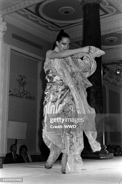 Models pose in ensembles from Zandra Rhodes "Conceptual Chic" collection inspired by London's punk style street fashions.