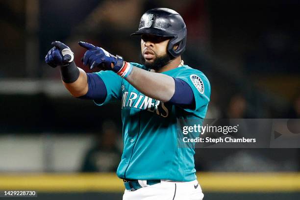 Carlos Santana of the Seattle Mariners celebrates his double during the fourth inning against the Oakland Athletics at T-Mobile Park on September 30,...