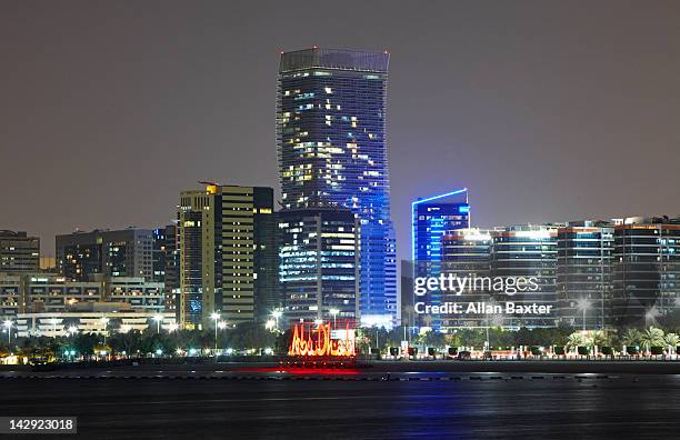 skyscrapers overlooking marina - abu dhabi skyline night stock pictures, royalty-free photos & images