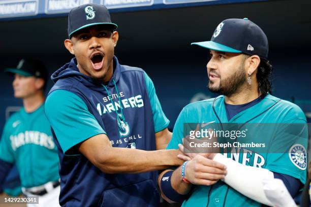 Julio Rodriguez and Eugenio Suarez of the Seattle Mariners joke before the game against the Oakland Athletics at T-Mobile Park on September 30, 2022...