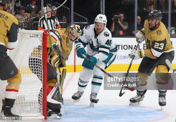 The puck bounces off the back of Adin Hill of the Vegas Golden Knights and into the net for a goal after a shot by Luke Kunin of the San Jose Sharks...