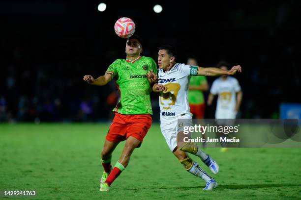 Alan Medina of Juarez fights for the ball with Efrain Velarde of Pumas during the 17th round match between FC Juarez and Pumas UNAM as part of the...