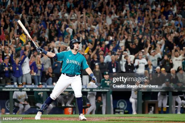 Cal Raleigh of the Seattle Mariners celebrates his walk-off home run during the ninth inning against the Oakland Athletics at T-Mobile Park on...