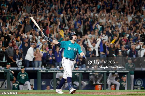 Cal Raleigh of the Seattle Mariners celebrates his walk-off home run during the ninth inning against the Oakland Athletics at T-Mobile Park on...