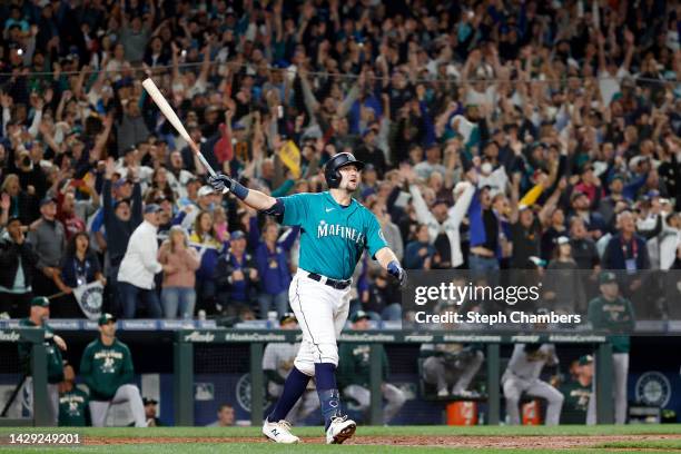 Cal Raleigh of the Seattle Mariners celebrates his walk-off home run during the ninth inning against the Oakland Athletics at T-Mobile Park on...
