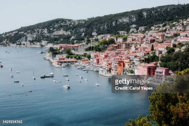 villefranche-sur-mer filled with boats off the shoreline - france skyline stock pictures, royalty-free photos & images