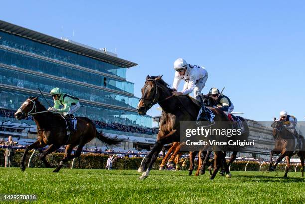 Michael Dee riding Lunar Flare defeats Craig Williams riding Francesco Guardi in Race 6, the The Lexus Bart Cummings, during Turnbull Stakes Day at...