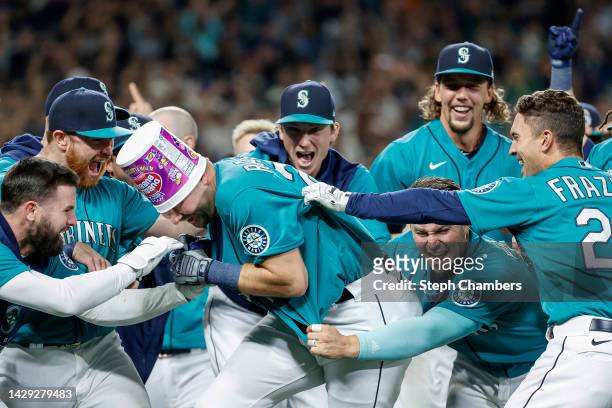 Cal Raleigh of the Seattle Mariners celebrates his walk-off home run during the ninth inning against the Oakland Athletics at T-Mobile Park on...