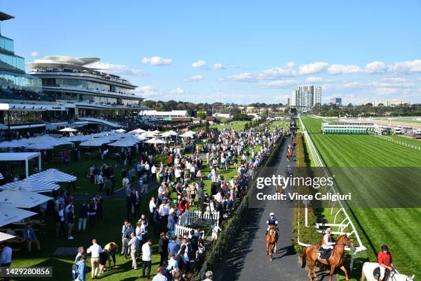 General view of crowds as Vow and Declare heads to the start of Race 6, the The Lexus Bart Cummings, during Turnbull Stakes Day at Flemington...