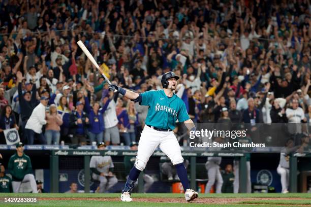 Cal Raleigh of the Seattle Mariners celebrates his walk-off home run during the ninth inning against the Oakland Athletics at T-Mobile Park on...