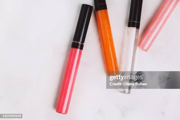 colored lip glosses. - glitter lips stock pictures, royalty-free photos & images