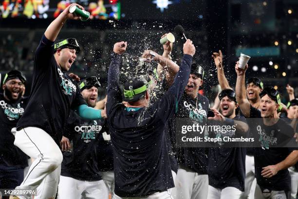 Manager Scott Servais of the Seattle Mariners celebrates after clinching a postseason birth after beating the Oakland Athletics 2-1 at T-Mobile Park...