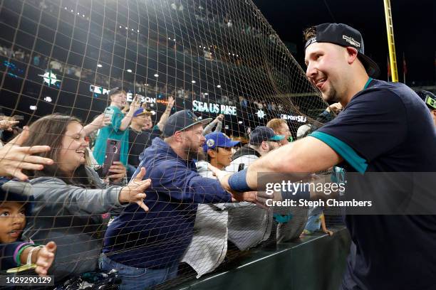 Cal Raleigh of the Seattle Mariners celebrates after a walk-off home run during the ninth inning against the Oakland Athletics at T-Mobile Park on...