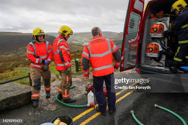 Greater Manchester Fire and Rescue personnel arrive to pump out a water logged dig site as police forensic teams dig on Saddleworth Moor for murder...