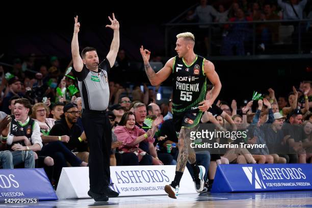 Mitchell Creek of the Phoenix signals his 3 points during the round one NBL match between South East Melbourne Phoenix and Tasmania JackJumpers at...