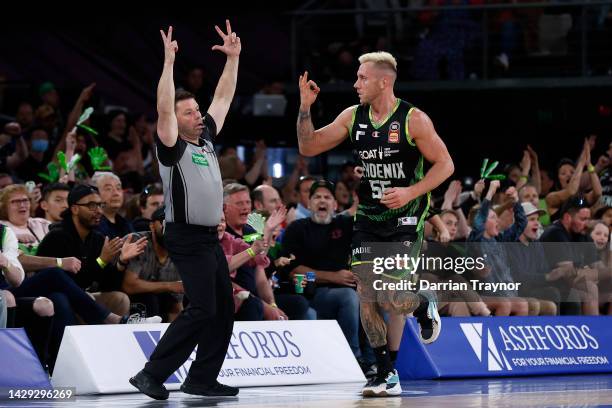 Mitchell Creek of the Phoenix signals his 3 points during the round one NBL match between South East Melbourne Phoenix and Tasmania JackJumpers at...