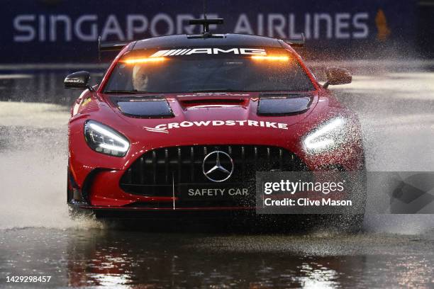 The FIA Safety Car drives on a wet track during final practice ahead of the F1 Grand Prix of Singapore at Marina Bay Street Circuit on October 01,...