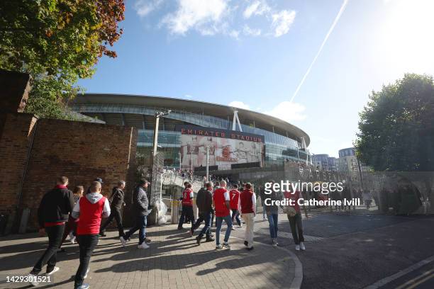 Fans arrive at the stadium prior to the Premier League match between Arsenal FC and Tottenham Hotspur at Emirates Stadium on October 01, 2022 in...