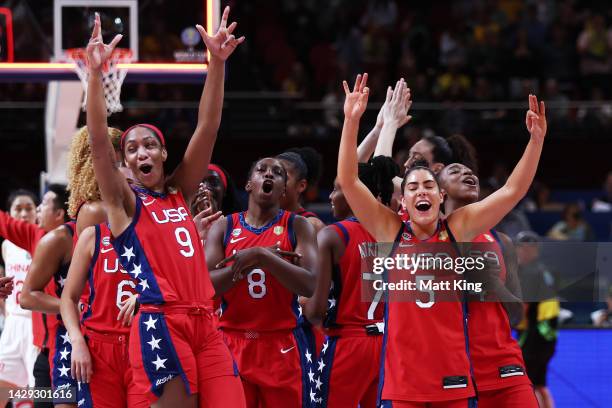 Ja Wilson, Chelsea Gray and Kelsey Plum of the United States celebrate victory with team mates after the 2022 FIBA Women's Basketball World Cup Final...