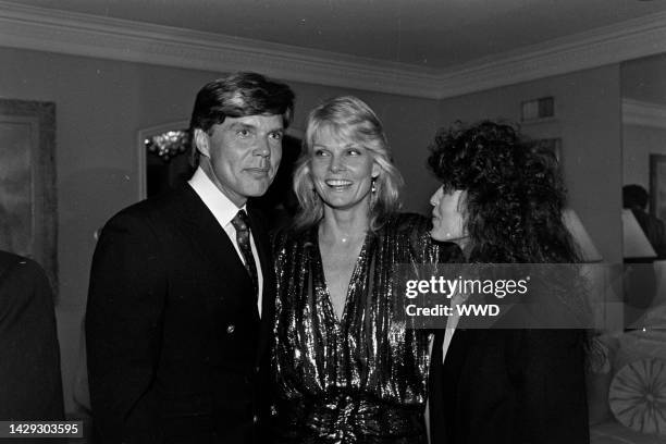 John Davidson, Cathy Lee Crosby, and Rhonda Rivera attend a party at the Beverly Hills, California, home of producer Jerry Weintraub on February 22,...