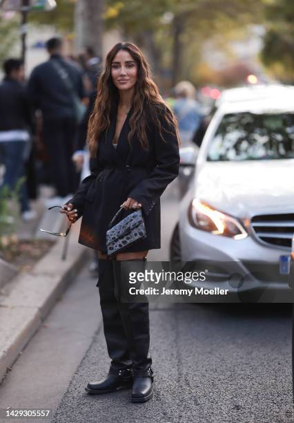 Tamara Kalinic seen wearing a blazer dress and acne studios bag, outside Acne Studios during Paris Fashion Week on September 28, 2022 in Paris,...