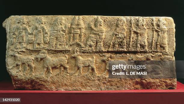 Sacred banquet in the presence of a royal couple, relief on a ritual basin unearthed in Temple B in Ebla, Syria. Assyrian civilisation, ca 1850 BC....