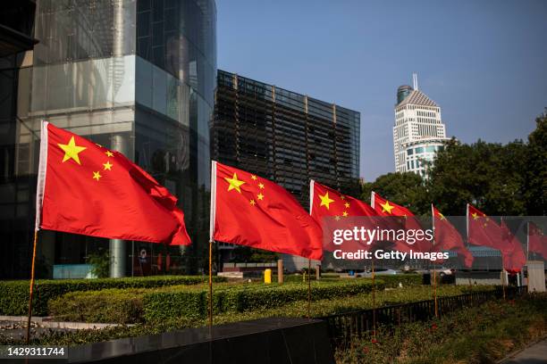 The national flag of China is displayed in a street on October 1, 2023 in Wuhan, Hubei province, China. China is celebrating their 73nd National Day...