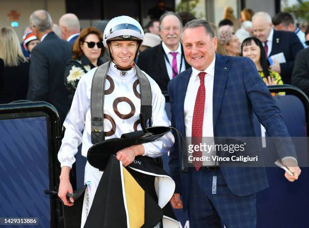 Michael Dee poses with trainer Grahame Begg riding Lunar Flare winning Race 6, the The Lexus Bart Cummings, during Turnbull Stakes Day at Flemington...
