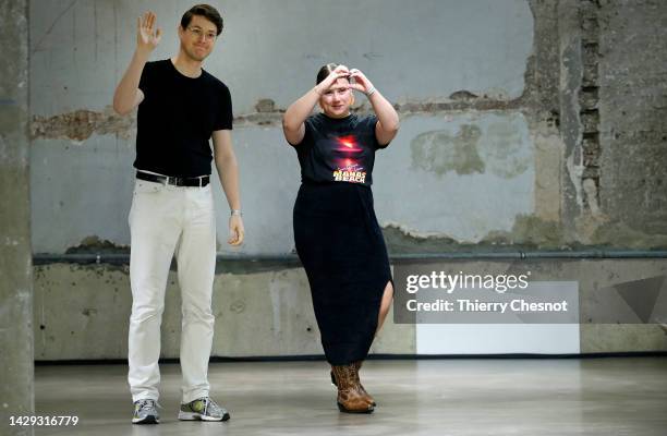 Designers, Ester Manas and Balthazar Delepierre acknowledges the audience at the end of the Ester Manas Womenswear Spring/Summer 2023 show as part of...