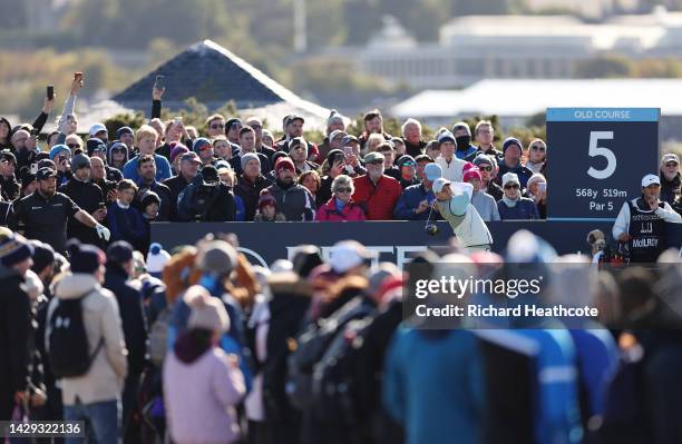 Crowds and Shane Lowry of Ireland look on as Rory McIlroy of Northern Ireland tees off on the 5th hole on Day Three of the Alfred Dunhill Links...