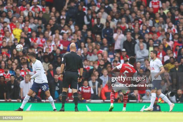 Thomas Partey of Arsenal scores their sides first goal during the Premier League match between Arsenal FC and Tottenham Hotspur at Emirates Stadium...