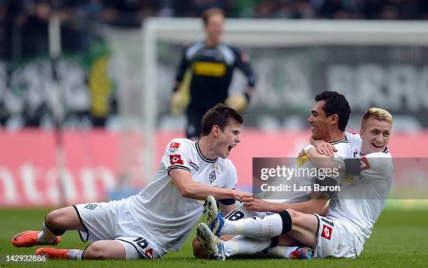 Juan Arango of Moenchengladbach celebrates with team mates Havard Nordtveit and Marco Reus after scoring his teams first goal during the Bundesliga...