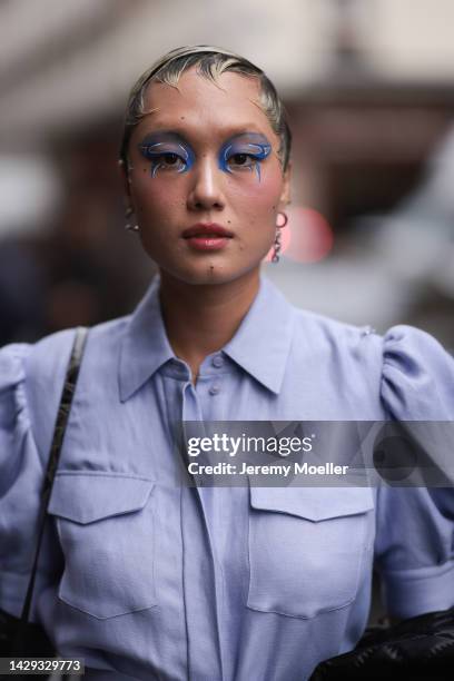 Kiki Yang Zhang seen wearing a blue blouse dress and statement hairs, black leather handbag outside Rochas, during Pariser Fashioon September 28,...