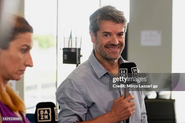 Carlos Checa of Spain smiles in media center during the MotoGP of Thailand - Qualifying at Chang International Circuit on October 01, 2022 in...