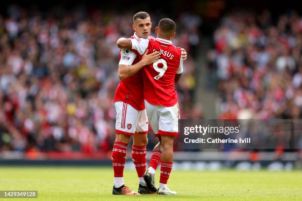 Granit Xhaka of Arsenal interacts with Gabriel Jesus of Arsenal after being substituted during the Premier League match between Arsenal FC and...