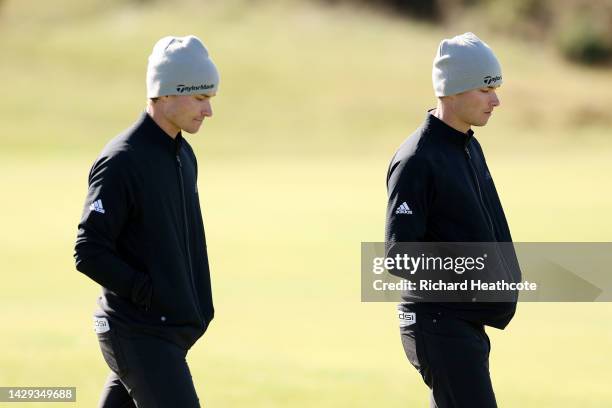 Rasmus Hojgaard of Denmark and Nicolai Hojgaard of Denmark walk down the fairway on the 5th hole on Day Three of the Alfred Dunhill Links...