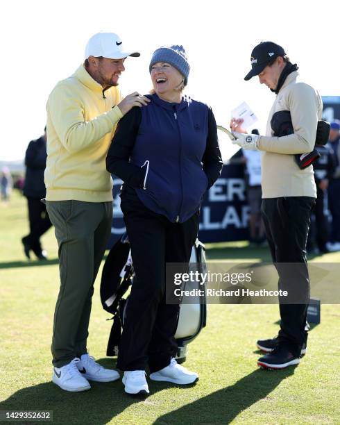 Alex Fitzpatrick of England laughs with Susan Fitpatrick, as Matthew Fitzpatrick reviews their scorecard on Day Three of the Alfred Dunhill Links...