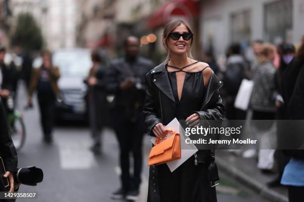 Nina Suess seen wearing midi black dress, black leather jacket, leather handbag and black heels outside Rochas, during Pariser Fashion Week on...