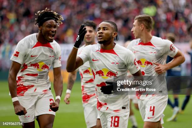 Christopher Nkunku of RB Leipzig celebrates after scoring their team's second goal from the penalty spot during the Bundesliga match between RB...