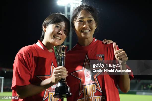 Naomoto Hikaru and Kozue Ando of Mitsubishi Heavy Industries Urawa Red Diamonds Ladies celebrate with the trophy after the WE League Cup final...