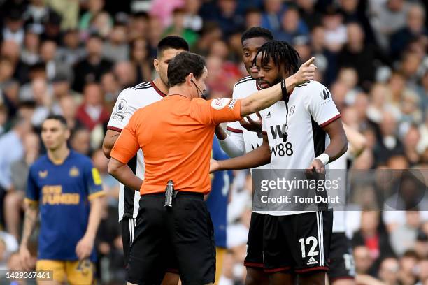 Nathaniel Chalobah of Fulham reacts after being shown a red card by match referee Darren England during the Premier League match between Fulham FC...