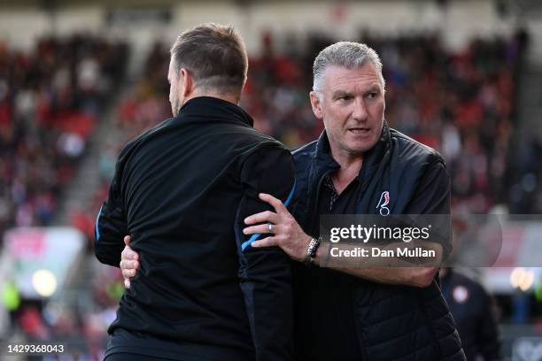 Nigel Pearson, Manager of Bristol City embraces Michael Beale, Manager of Queens Park Rangers during the Sky Bet Championship between Bristol City...