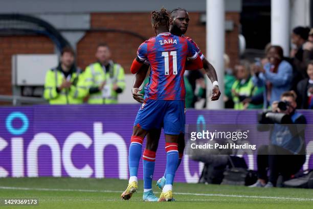 Odsonne Eduoard of Crystal Palace celebrates with teammate Wilfried Zaha after scoring their team's first goal during the Premier League match...
