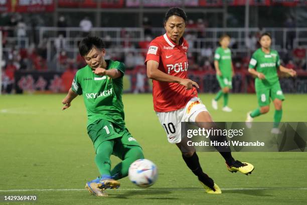 Aoba Fujino of Tokyo Verdy NTV Bereza and Kozue Ando of Mitsubishi Heavy Industries Urawa Red Diamonds Ladies compete for the ball during the WE...