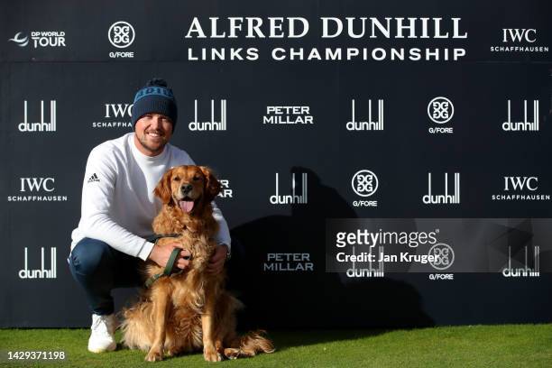 Richard Mansell of England poses with their dog, Arnie, after their round on Day Three of the Alfred Dunhill Links Championship at Carnoustie Golf...