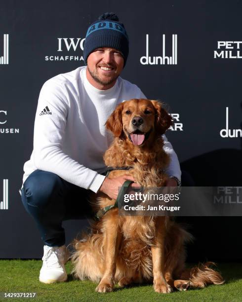 Richard Mansell of England poses with their dog, Arnie, after their round on Day Three of the Alfred Dunhill Links Championship at Carnoustie Golf...